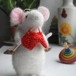 A felt figure of a mouse nitting made using the Makerss Small Knitting Mouse Needle Felt Kit.
