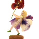The Makerss Official Flower Fairies™️ - Pansy Fairy Needle Felt Kit. A handmade felted Fairy with purple gradient wings and dress, and a red and yellow pansy flower in its hand. On a white background
