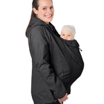 A person wearing the Mamalila Outdoor Explorer Babywearing Jacket - Black