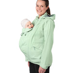  with their hands on their stomach over the top of the coat