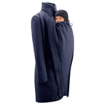 Mamalila Eco Wool Oslo Babywearing Coat in Navy. A navy blue organic boiled wool winter babywearing coat. Side view, collar up, with baby wearing insert on front. White background.  