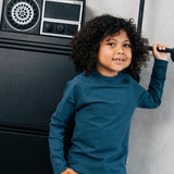 Child wearing the Maxomorra organic cotton kids blue long sleeved top with matching trousers.