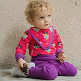 A baby wearing the Maxomorra Fairy print long sleeve bodysuit with a matching bib.  