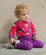 A baby wearing the Maxomorra Fairy print long sleeve bodysuit with a matching bib.  