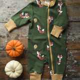 Maxomorra Fox Organic Cotton zip up Babygrow placed on a wooden surface with munchkin pumpkin placed next to it.
