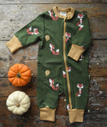 Maxomorra Fox Organic Cotton zip up Babygrow placed on a wooden surface with munchkin pumpkin placed next to it.