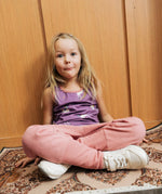 Girl wearing Maxomorra unicorn print purple vest top with pink Organic Cotton Waist Pants trousers.