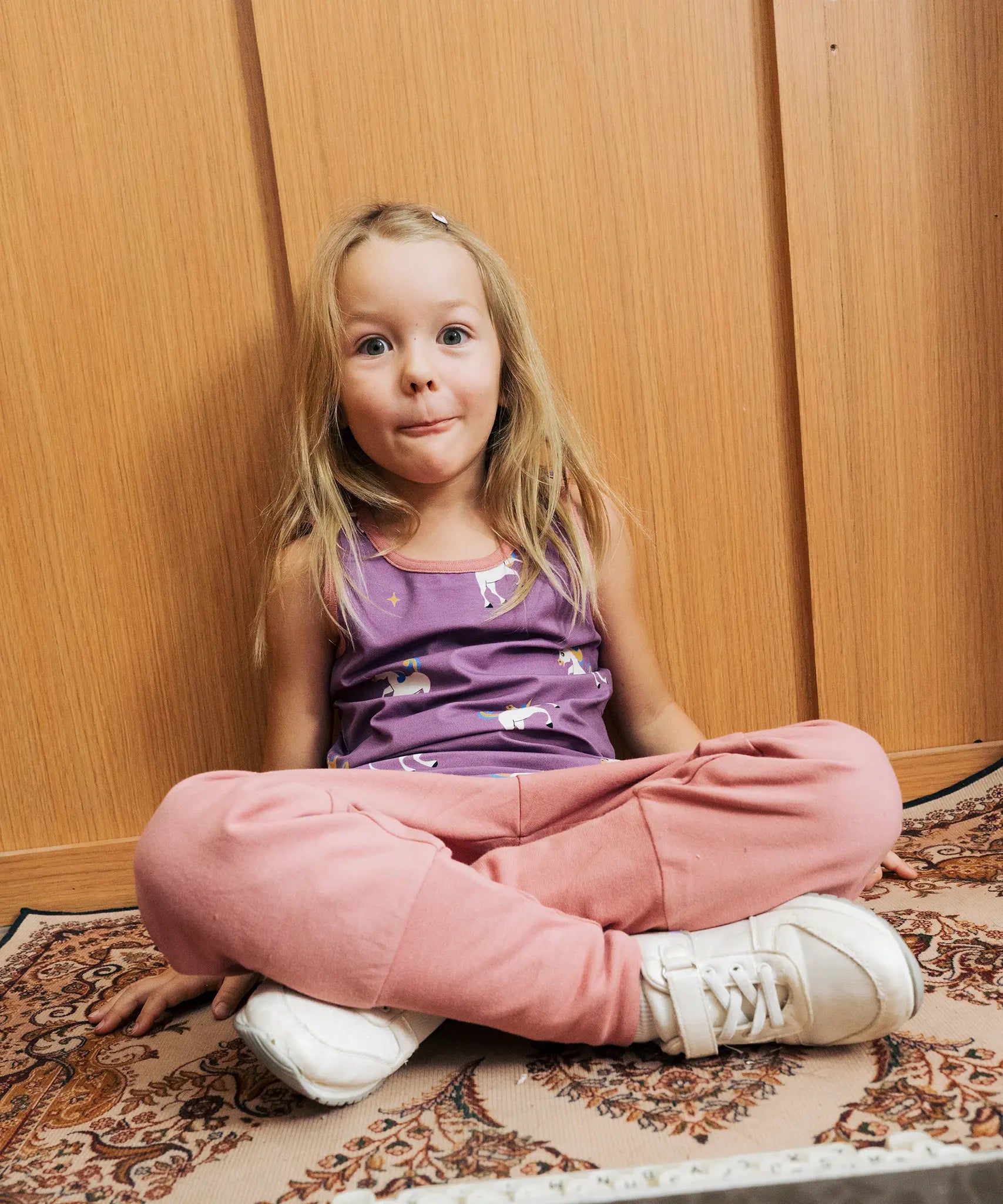Girl wearing Maxomorra unicorn print purple vest top with pink Organic Cotton Waist Pants trousers.