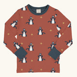 Maxomorra kids dragons organic cotton long sleeve top. Red top with repeat blue dragon print and blue arm cuffs and binding on the neck. 
