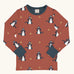 Maxomorra kids dragons organic cotton long sleeve top. Red top with repeat blue dragon print and blue arm cuffs and binding on the neck. 
