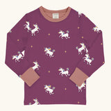 Maxomorra kids unicorns organic cotton long sleeve top. Purple top with  repeat unicorn print and light pink arm cuffs and binding on the neck. 
