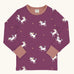 Maxomorra kids unicorns organic cotton long sleeve top. Purple top with  repeat unicorn print and light pink arm cuffs and binding on the neck. 
