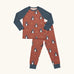 Maxomorra kids organic cotton long sleeved top and trousers pyjama set with dragon print. Red background with blue dragons with yellow fire outlines. The top has blue block colour arms and neck trim, the trousers have blue leg cuffs.