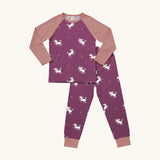 Maxomorra kids organic cotton long sleeved top and trousers pyjama set with unicorns print. Purple background with unicorns with multi coloured manes and yellow sparkles. The top has pink block colour arms and neck trim, the trousers have pink leg cuffs.