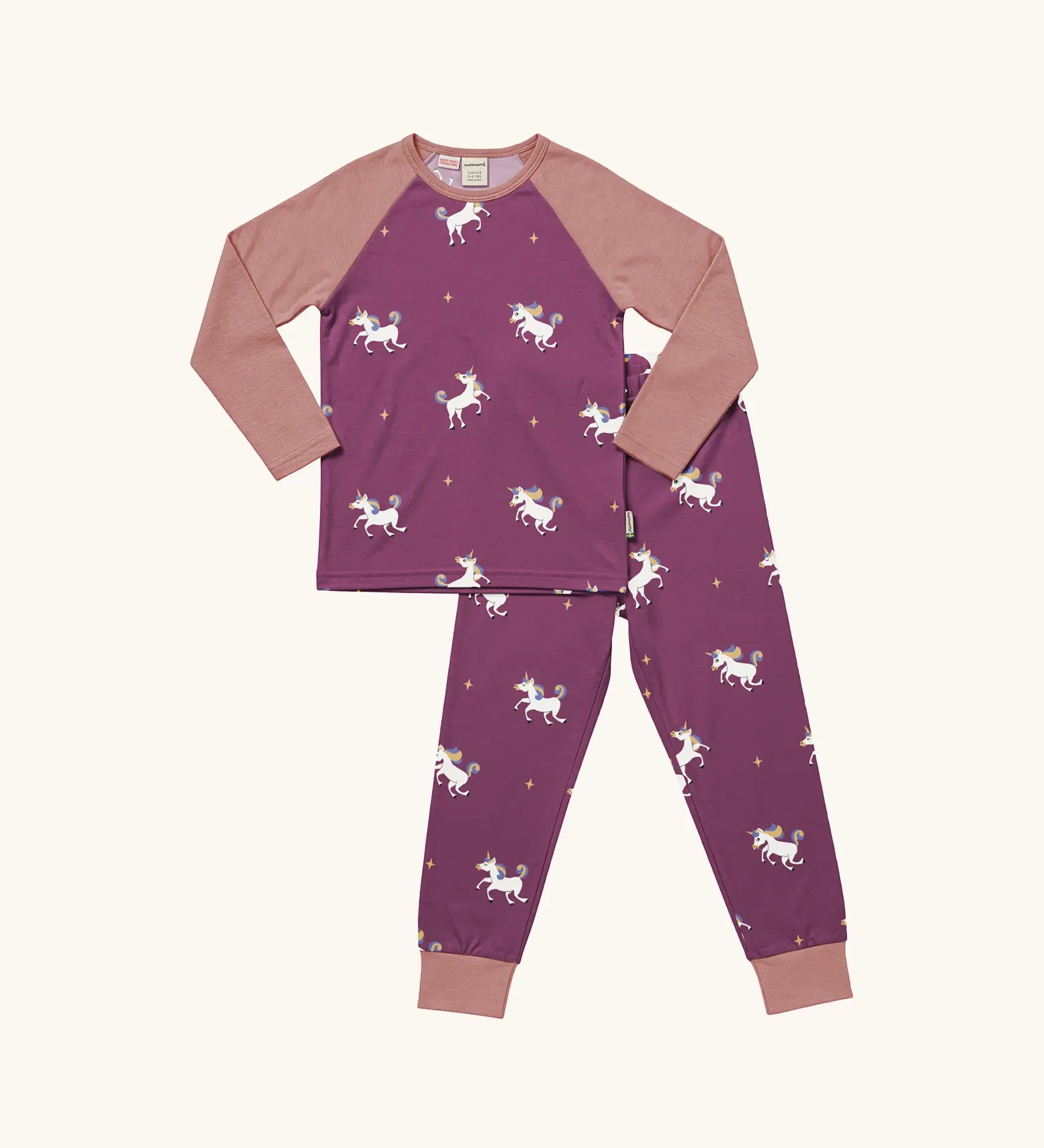 Maxomorra kids organic cotton long sleeved top and trousers pyjama set with unicorns print. Purple background with unicorns with multi coloured manes and yellow sparkles. The top has pink block colour arms and neck trim, the trousers have pink leg cuffs.