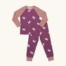 Maxomorra kids organic cotton long sleeved top and trousers pyjama set with unicorns print. Purple background with unicorns with multi coloured manes and yellow sparkles. The top has pink block colour arms and neck trim, the trousers have pink leg cuffs.