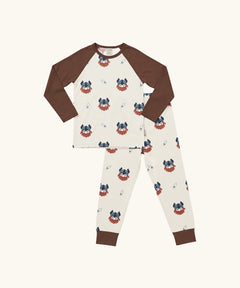 Maxomorra kids organic cotton long sleeved top and trousers pyjama set with vikings print. Light cream background with bearded viking wearing a hat and blue dagger sword outlines. The top has brown block colour arms and neck trim, the trousers have brown leg cuffs.