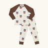 Maxomorra kids organic cotton long sleeved top and trousers pyjama set with vikings print. Light cream background with bearded viking wearing a hat and blue dagger sword outlines. The top has brown block colour arms and neck trim, the trousers have brown leg cuffs.