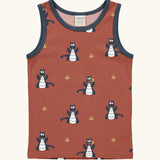 Maxomorra kids dragons organic cotton vest. Red sleeveless vest top with repeat print featuring a blue dragon and yellow fire outlines with blue binding on the neck and arm holes. 
