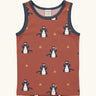 Maxomorra kids dragons organic cotton vest. Red sleeveless vest top with repeat print featuring a blue dragon and yellow fire outlines with blue binding on the neck and arm holes. 

