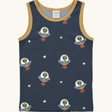 Maxomorra kids unicorns organic cotton vest. Blue sleeveless vest top with repeat print featuring a green alien in a UGO and white stars with yellow binding on the neck and arm holes. 

