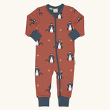 Maxomorra organic cotton zipped babygrow with dragon print. Red background with repeat print featuring blue dragons with yellow fire outlines and blue arm cuffs, binding on the neck and zip. 