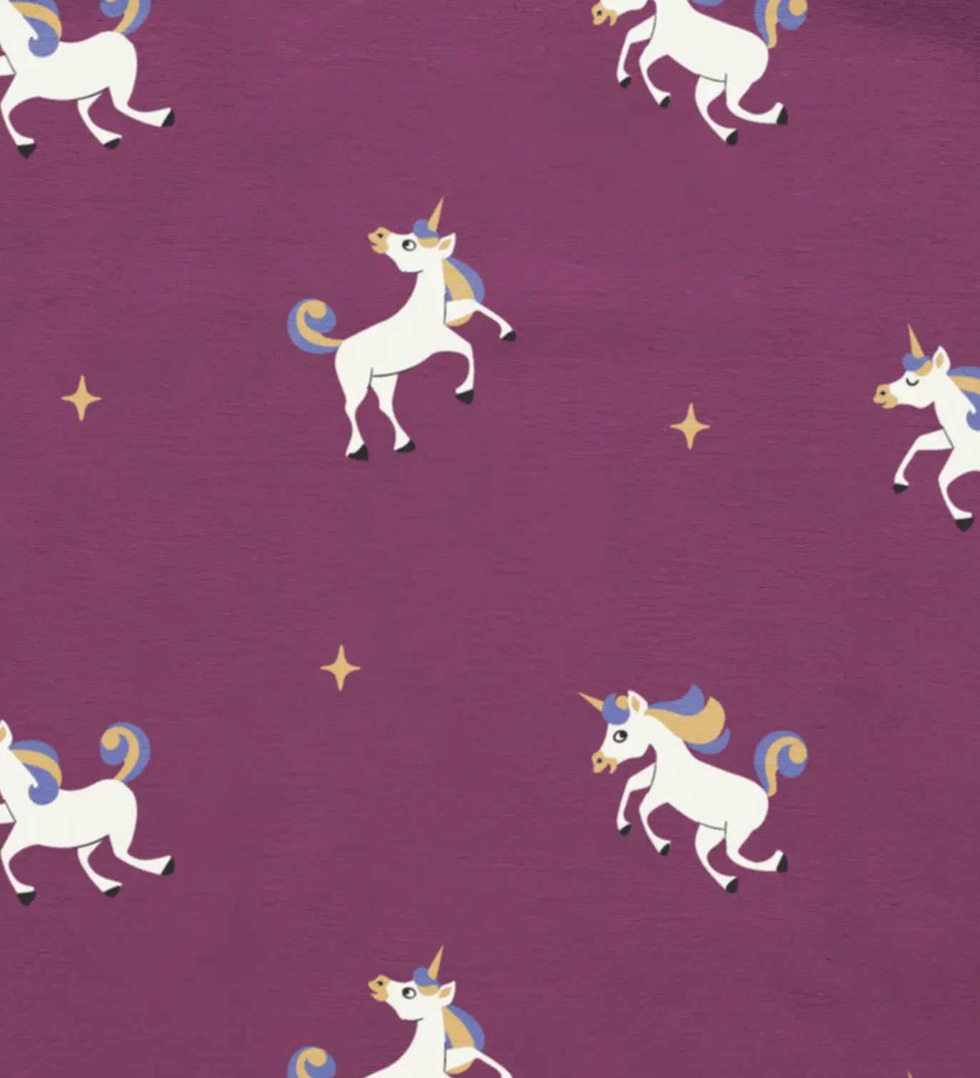 Maxomorra unicorns print on organic cotton. Purple background with all over repeat print featuring unicorns with multicoloured manes and yellow sparkles. 