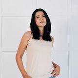 Woman wearing the Maxomorra Women's blue Organic Cotton Hipster Briefs with owl print and a cream vest top.