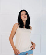 Woman wearing the Maxomorra Women's blue Organic Cotton Hipster Briefs with owl print and a cream vest top.