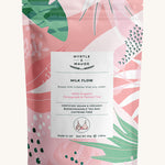 Pink with leaves milk flow tea pouch on a cream background.