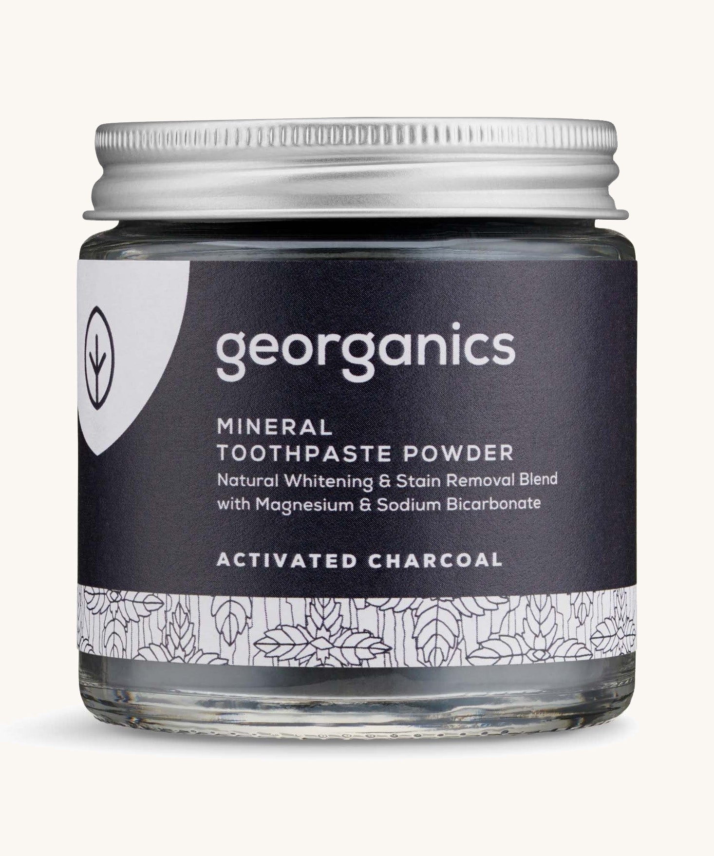  A jar of the charcoal Georganics toothpaste powder on a cream background