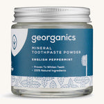  A jar of the peppermint Georganics toothpaste powder on a cream background