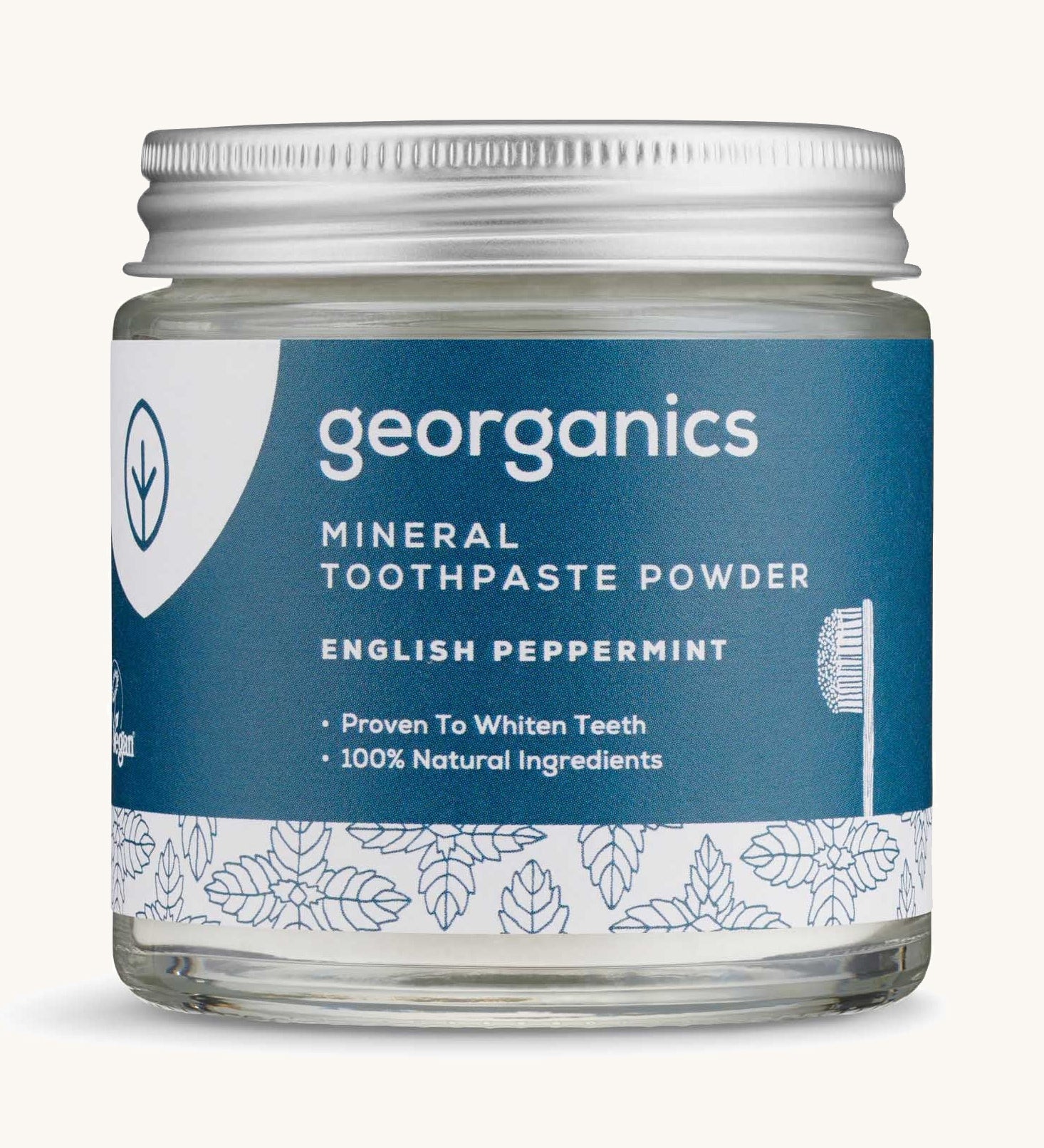  A jar of the peppermint Georganics toothpaste powder on a cream background