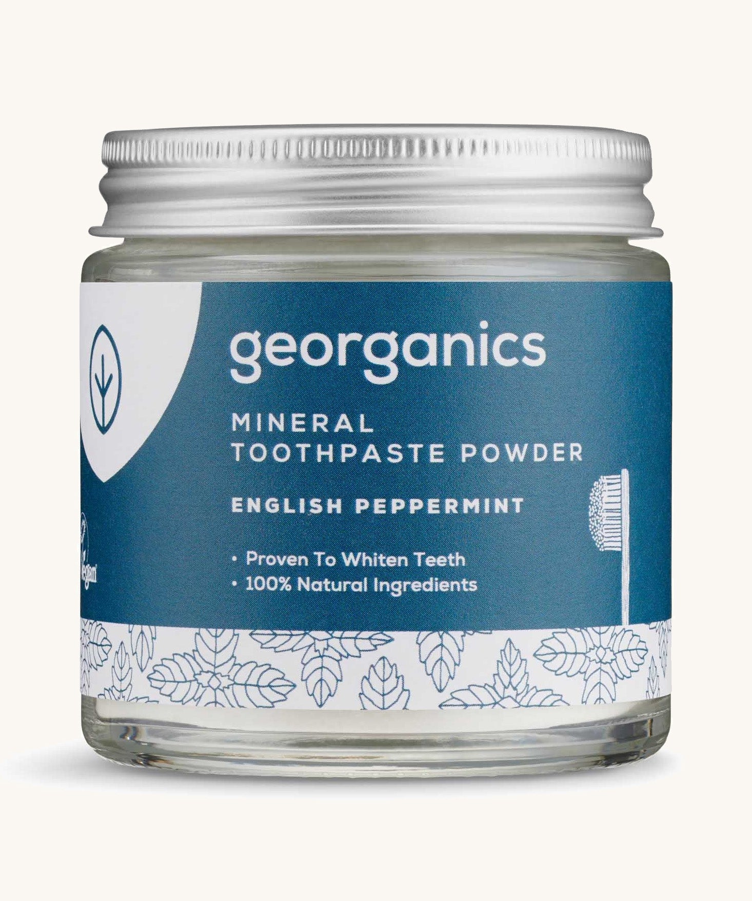  A jar of the peppermint Georganics toothpaste powder on a cream background