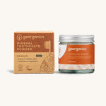  A jar of the orange Georganics toothpaste powder with the box