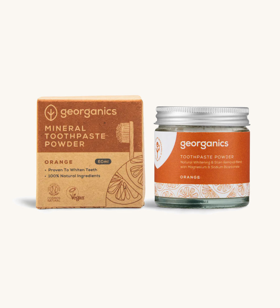  A jar of the orange Georganics toothpaste powder with the box