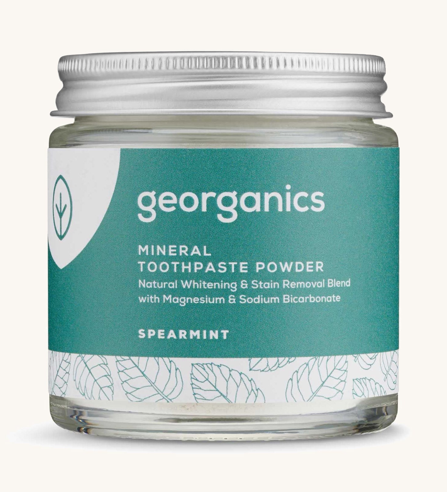  A jar of the spearmint Georganics toothpaste powder on a cream background