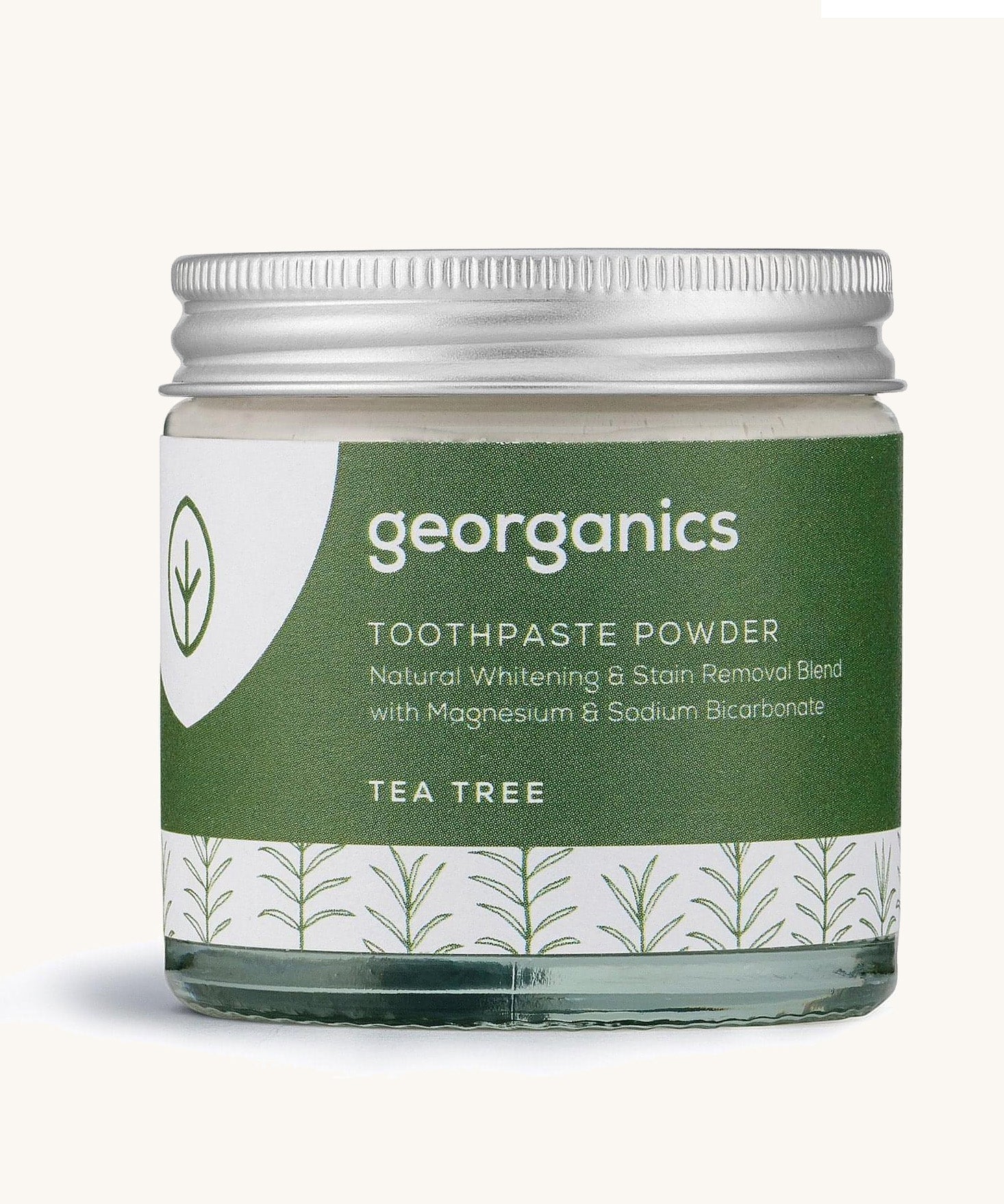  A jar of the tea tree  Georganics toothpaste powder on a cream background