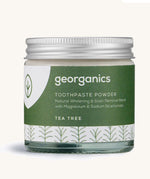  A jar of the tea tree  Georganics toothpaste powder on a cream background