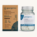A jar of the Georganics english peppermint toothpaste tablets with the box