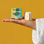 A person using the Lamazuna Nourishing Dream Cream Bar to moisturise their leg
