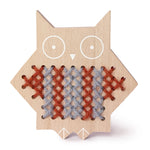 Moon Picnic cross stitch wooden owl toy on a white background