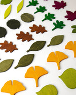 Moon Picnic eco-friendly wooden leaves laid out in rows on a white background