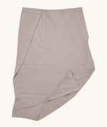 MORI cellular blanket in biscuit laid out showing the air hole detail on organic fabric. 