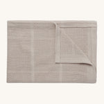 MORI cellular blanket in biscuit. A 100% organic fabric blanket in a neutral colour with air hole to keep cool and warm on colder days. 