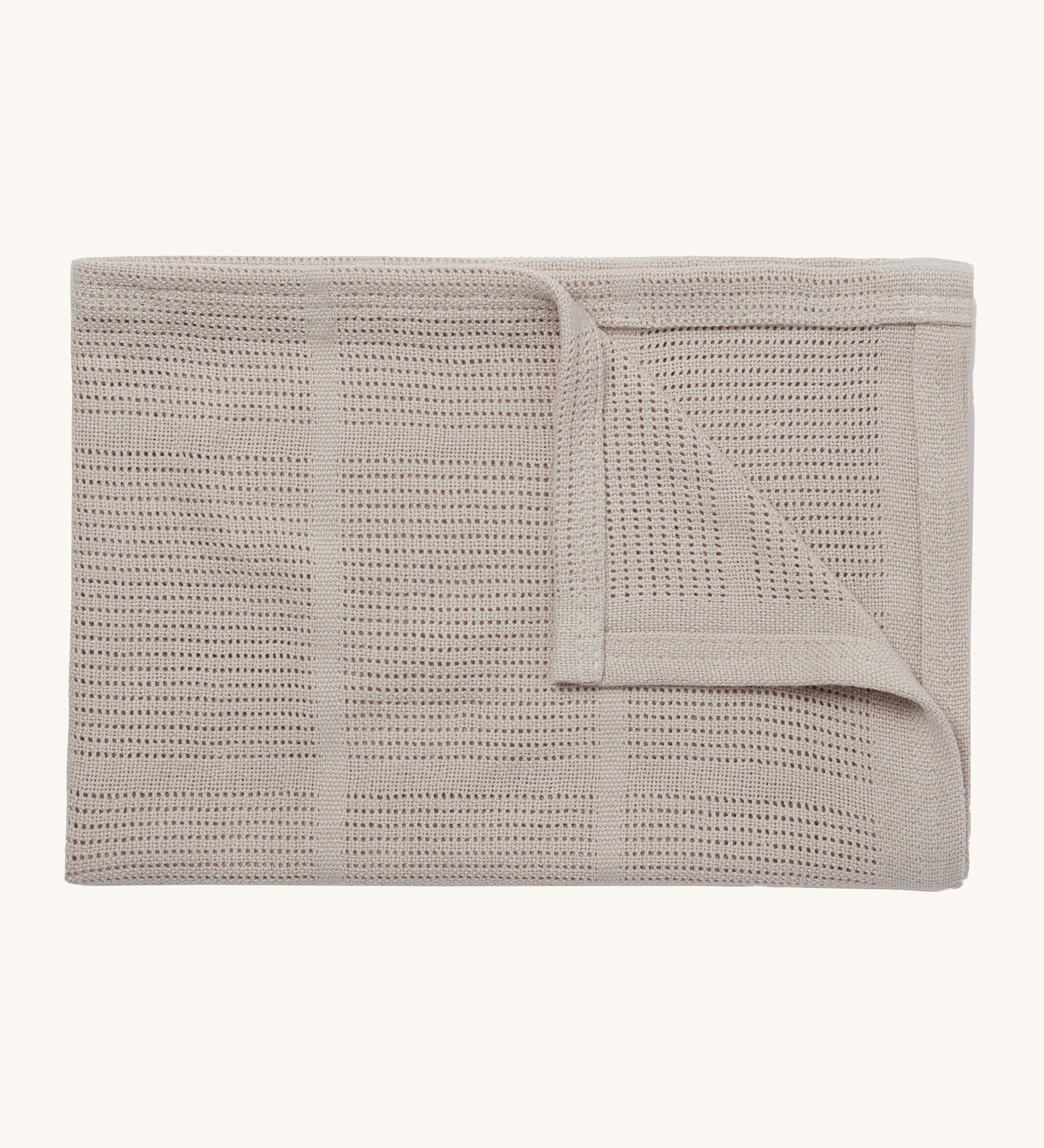 MORI cellular blanket in biscuit. A 100% organic fabric blanket in a neutral colour with air hole to keep cool and warm on colder days. 