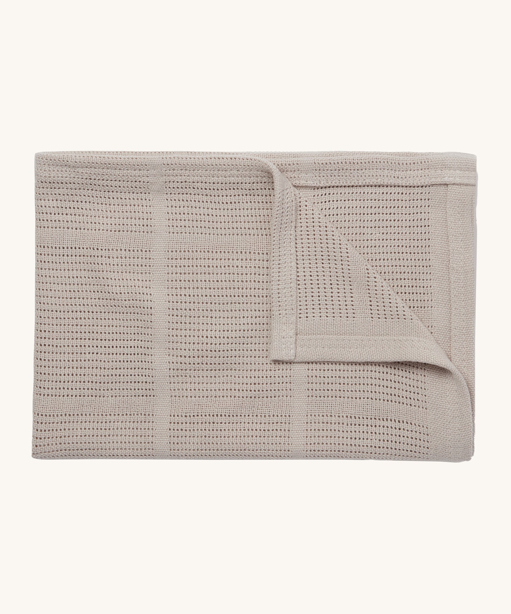 MORI cellular blanket in biscuit. A 100% organic fabric blanket in a neutral colour with air hole to keep cool and warm on colder days. 