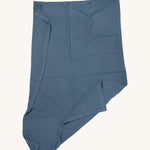 MORI cellular blanket in navy laid out showing the air hole detail on organic fabric. 