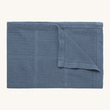 MORI cellular blanket in navy. A 100% organic fabric baby blanket in a dark blue colour with air hole to keep cool and warm on colder days. 