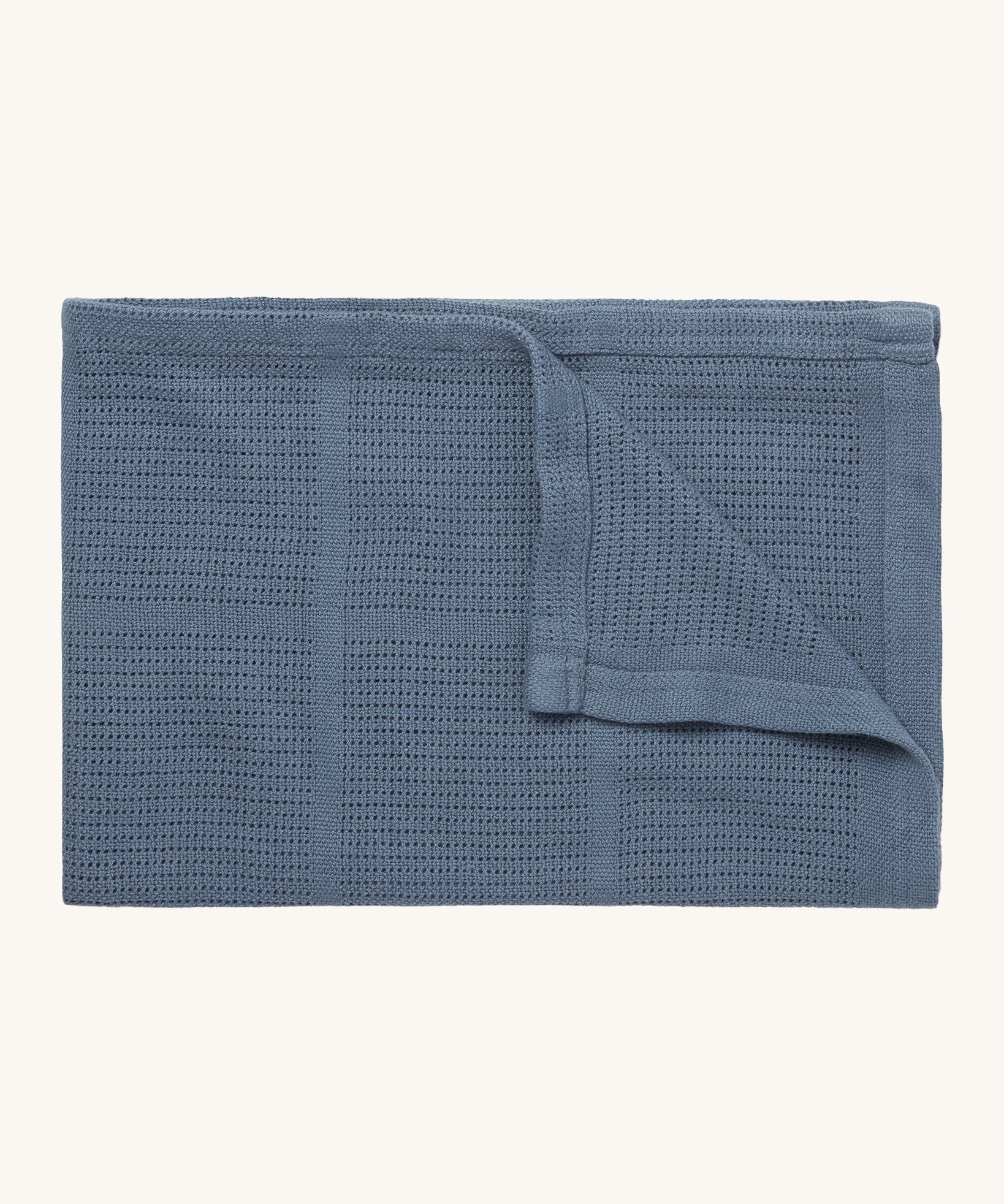 MORI cellular blanket in navy. A 100% organic fabric baby blanket in a dark blue colour with air hole to keep cool and warm on colder days. 
